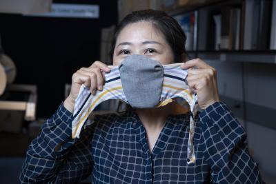 Researcher Sungmee Park shows mask details