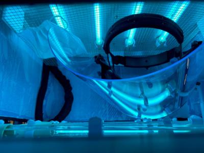 Face shield in portable disinfection chamber