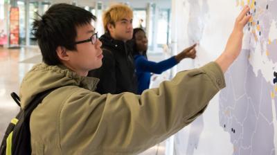 international education front page - students with map