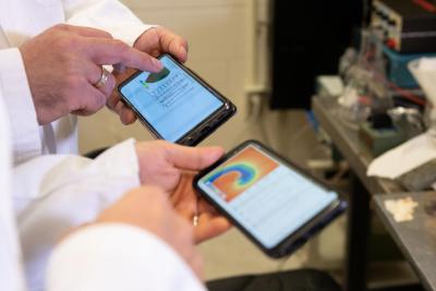 Smartphone screens showing cardiac simulations