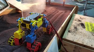 Mini Rover in laboratory track bed