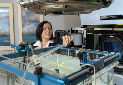 Anna Erickson with prototype radiation detector