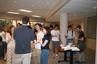 Graduate students enjoy tea and snacks at weekly g