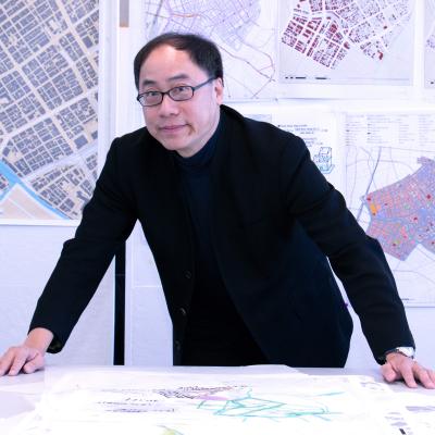 Perry Yang in front of Tokyo Smart City designs