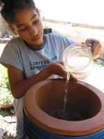 Young girl with water filter.