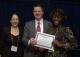 Sheila Isbell (right), Georgia Tech Research Institute, accepts poster award from Paul Spearman, MD, and Barbara Stoll, MD, Children's Healthcare of Atlanta.