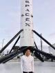 Daniel Kurniawan in front of the rocket at SpaceX