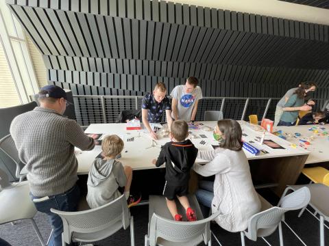 Aerospace students Ethan Sirak and Bill McNutt Jr. with the Georgia Space Grant Consortium teaching kids space facts and allowing them to perform crafts related to planets and space.