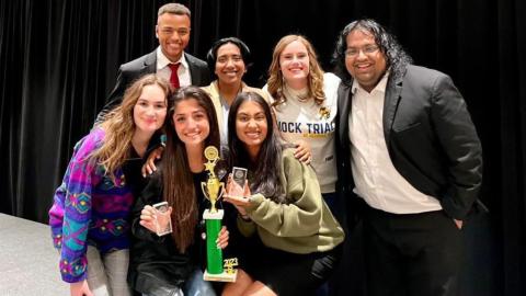 Mock Trial team members pose with their trophy