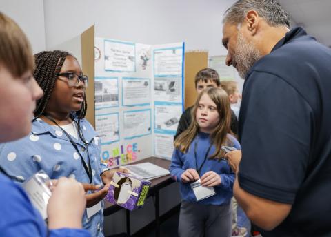 Students in Thomasville, Ga. explain their invention to a competition judge as a part of Georgia Tech’s expanding K-12 InVenture Prize program. 