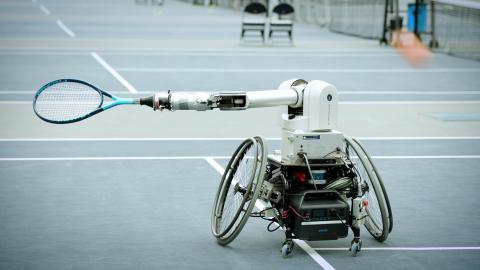 A tennis robot being developed at Georgia Tech set to return a ball hit towerd it from a human player