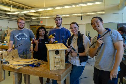 The team working in the College of Design’s woodworking space during the squirrel box-building event. Photo credit: Thomas Bordeaux, ARCH 2022. 