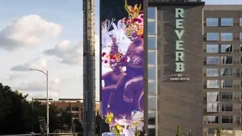Chanell Angeli art shown on the side of a building.