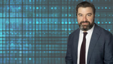 Decorative image of Justin Biddle on a blue background