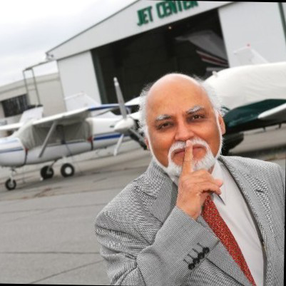Dr. Krishan Ahuja "shushes" jet engine noise.