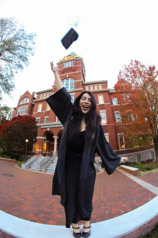 Kendra Garcia wearing cap and gown at Tech Tower