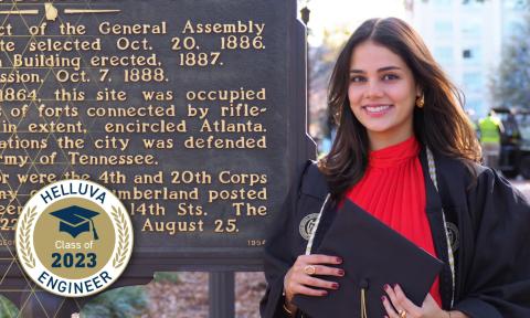 Nicole Proudfoot in front of the Georgia Tech historical marker with a "Helluva Engineer - Class of 2023" overlay graphic