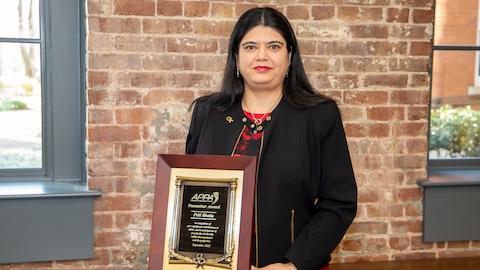 Director of Facilities and Capital Planning Priti Bhatia holding the APPA 2023 Pacesetter Award