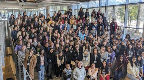 A group photo of nearly 200 students and faculty.
