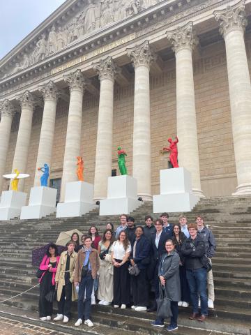 Group photo in front of building.