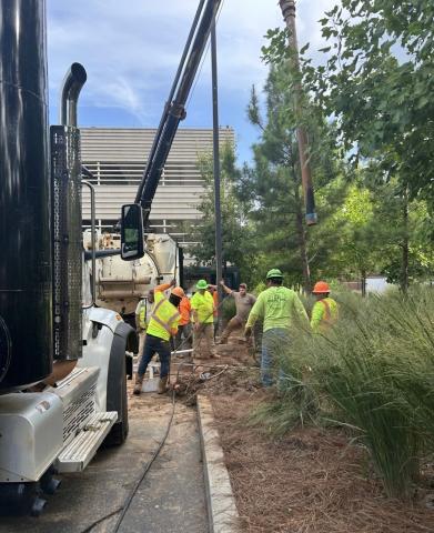Workers attend to the chilled water outage repair site.