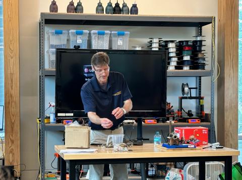 Rich Simmons demonstrating an experiment at the Energy Unplugged summer camp