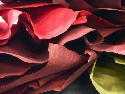 Stack of curling red and yellow paper