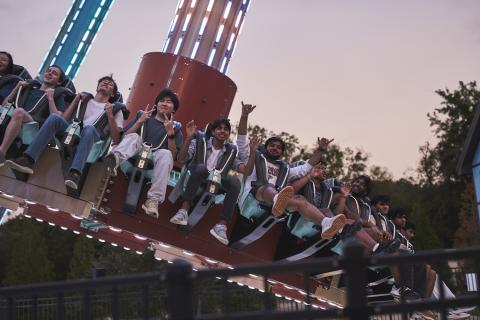 students on a ride at six flags with dusk sky