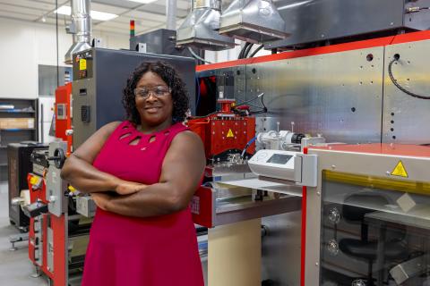 Tequila Harris, professor in the George W. Woodruff School of Mechanical Engineering, next to the modular R2R equipment.