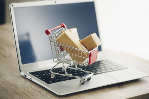 Shopping cart and laptop