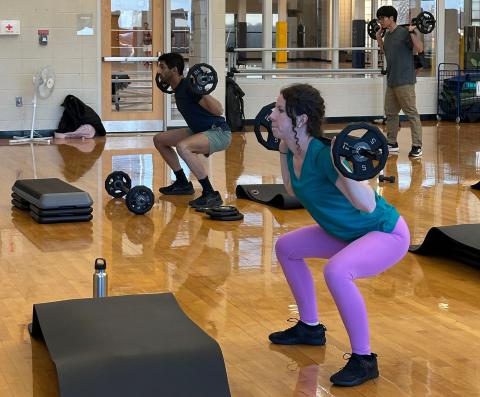 woman exercising in class