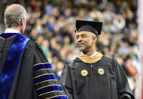 Georgia Tech student receives diploma at commencement ceremony.