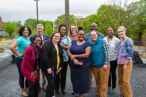 Staff in front of the Campanile on Teal Ribbon Day