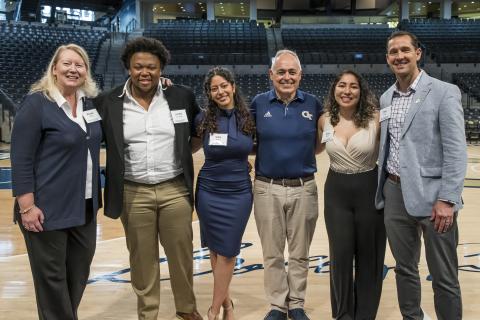 Three students joined by alumna Ronda Sides, President Angel Cabrera, and Rick Clark at the 2025 Scholarship Brunch.