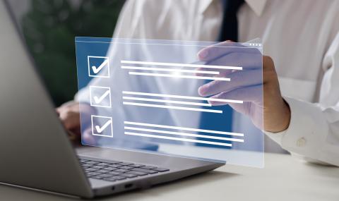 Businessman with tablet checklist