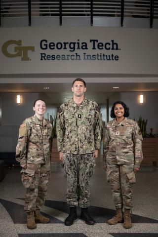 Three members of GTRI's latest cohort pose for a photo. 
