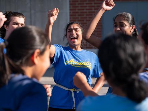 Students cheering at sporting event