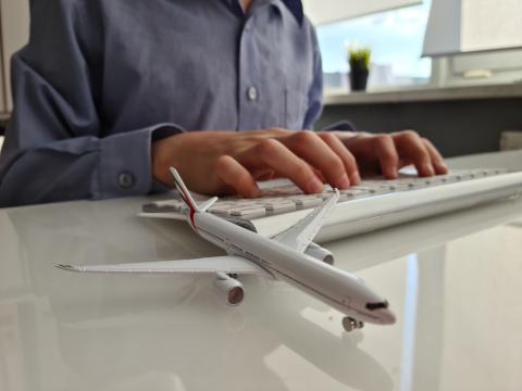 Person books plane ticket online.