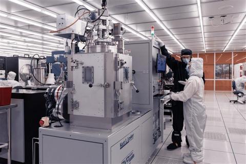 Student working with IMS staff in the fabrication cleanroom