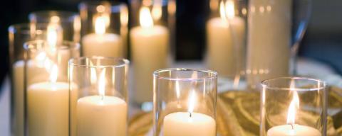 Images of candles burning at a service