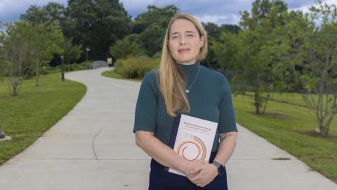 Woman standing on walking path