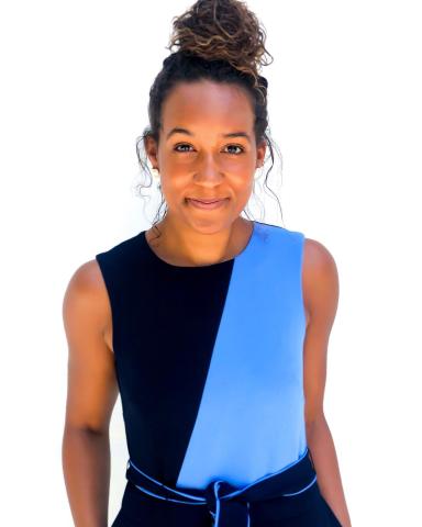 young woman in blue and black shirt