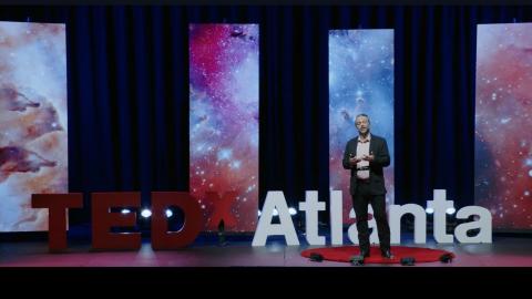 Brian Magerko on stage during his Tedx Talk.