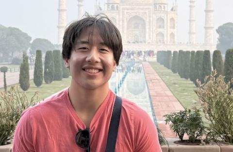 Graduating CS Major Andrew Wang outside the Taj Mahal