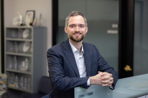 Joseph Greene poses in an office suite.