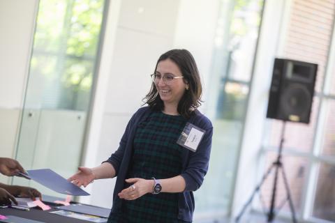 A woman accepting a certificate.