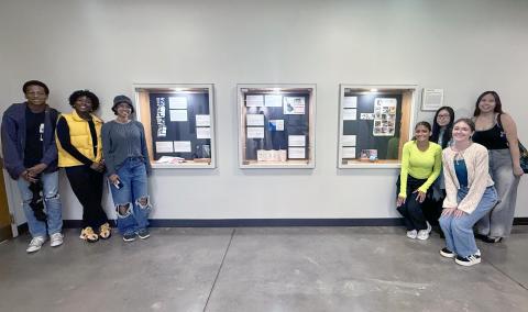 Students with display of zines