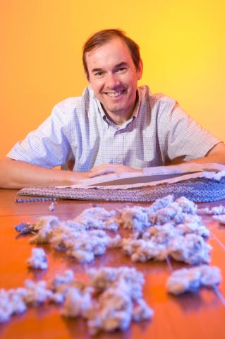 Portrait of Prof. Matthew Realf with carpet recycling samples.