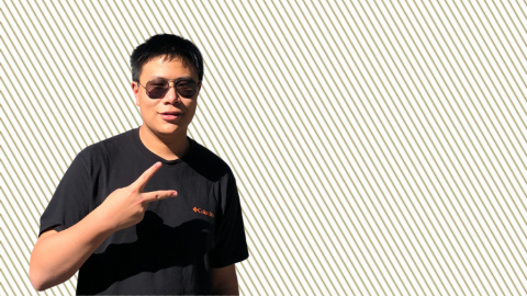 HSOC student Yihua Xu on a a gold striped background