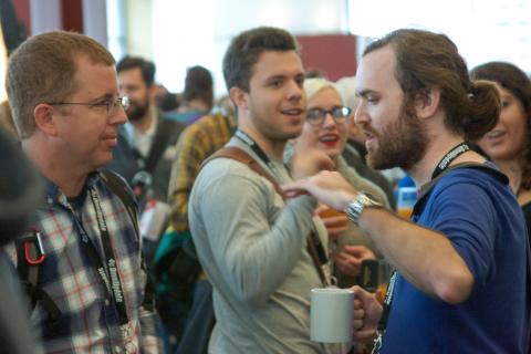 Eric Sembrat talking to Adam Arrowood.